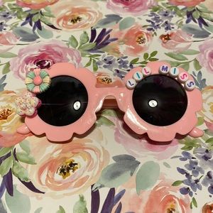 Girls light pink flower shaped LiL miss sunglasses